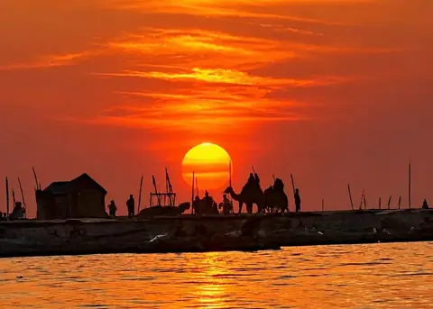 Golden sunset over the Poovar sandbar – Poovar Boating