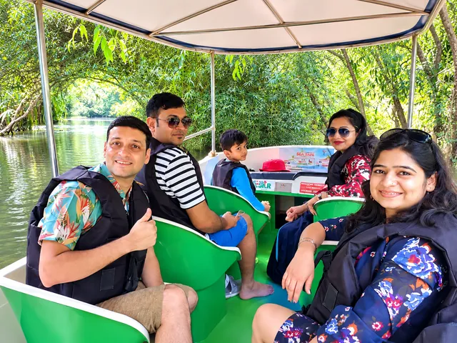 Family enjoying a motor boat cruise through the Poovar mangroves – Poovar Boating